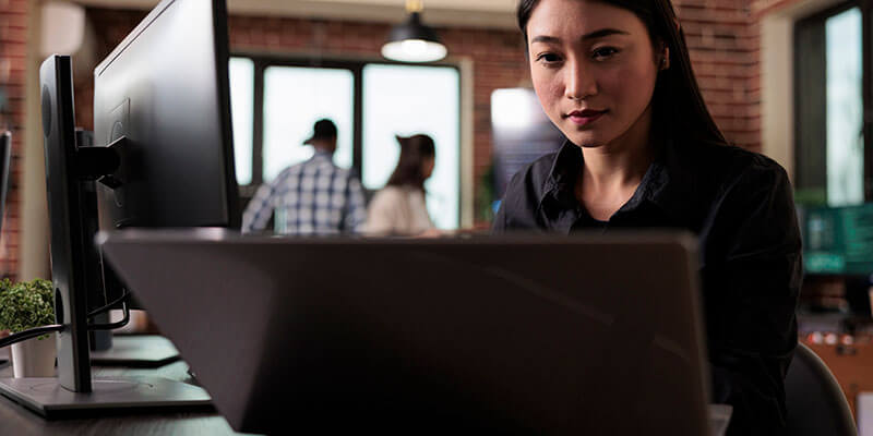 file encryption_woman-computer An Asian woman sends an encrypted file on her computer