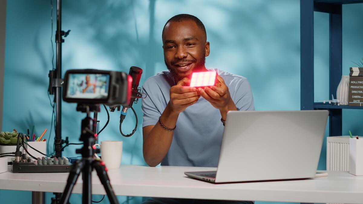 Blogger doing product review of light with multiple colors Placeholder image